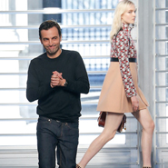 Nicolas Ghesquière takes a bow after his first Louis Vuitton runway show