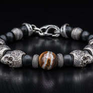 William Henry bracelet with onyx beads and fossilized wooly mammoth  tooth