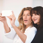 Behind-the-scenes shot of Gisele Bündchen and Lucia Pica 