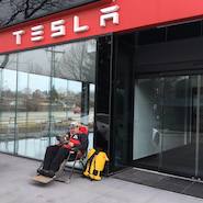 Man waiting for Tesla store to open in Toronto