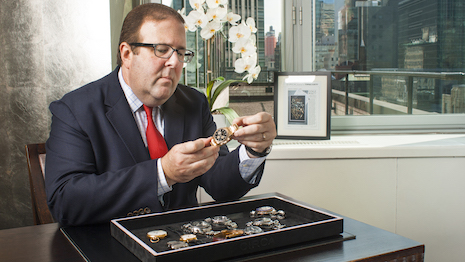 A circa team member appraising watches and jewelry for acquisition. Image courtesy of Circa