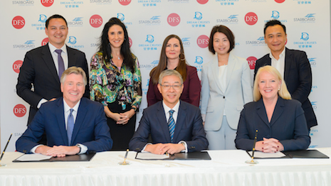 Signing ceremony for the tripartite deal: from left to right, DFS Group's Ed Brennan, Genting Cruise Lines' Kent Zhu and Starboard Cruise Services' Lisa Bauer. Image courtesy of Starboard Cruise Services and DFS Group