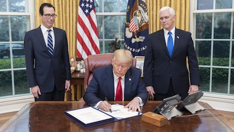 President Trump on March 19 signing the Families First Coronavirus Response Act. Image credit: The White House