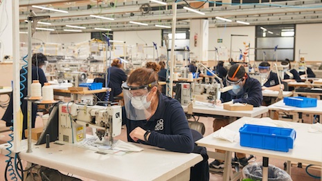 Loewe factory making masks for health workers fighting the spread of the COVID-19 coronavirus. Image courtesy of Loewe