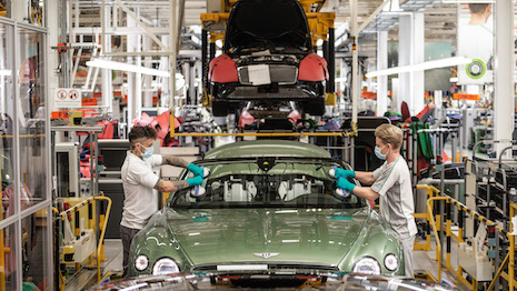 Employees on the Bentley Motors assembly line at the British automaker's factory in Crewe, England. Image courtesy of Bentley Motors