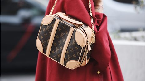 Louis Vuitton is the latest luxury giant to raise its prices in 2022, following Dior and Hermès. But will Chinese consumers keep buying? Image credit: Shutterstock