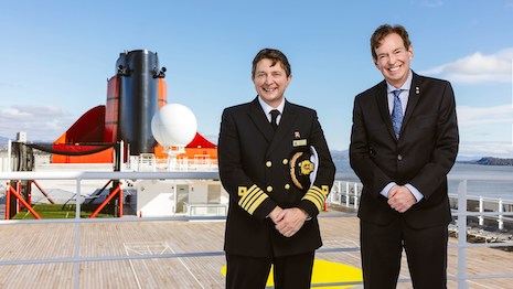 Captain Andrew Hall, master of Cunard flagship Queen Mary 2, and Royal Canadian Geographic Society CEO John Geiger. Image credit: Cunard