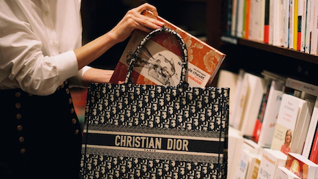 Emblematic of excellence in modern design, with standout sales to match, Dior's Book Tote anchors a new literary-minded discussion. Image credit: Dior