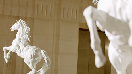 In an ode to the name uniting the luxury network of global maisons, a collection of white horse statues housed in the halls of Cheval Blanc Paris centers the first episode of “Creative Encounters.” Image credit: LVMH
