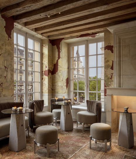 Large windows bring in natural light to the comfortable seating areas, showing off the modern city from the centuries-old establishment. Image credit: Moët Hennessy/Vincent Leroux
