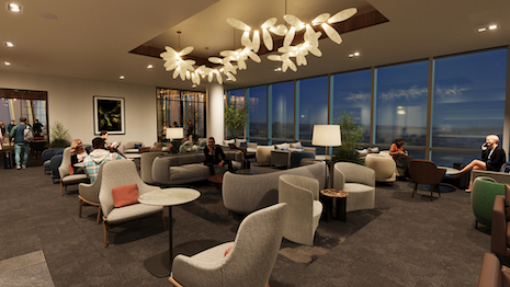 Multiple seating areas and dedicated workstations are a part of the incoming travel space. Image credit: American Express