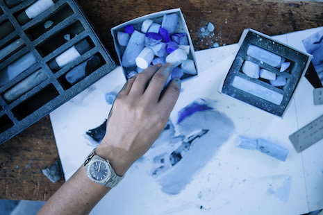 An Overseas watch is donned by the artist as she makes pastel versions of her Icelandic photographs. Image credit: Vacheron Constantin