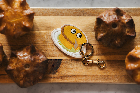 The British fashion designer created a limited-edition “Pie with Eyes” key ring, now available for purchase. Image courtesy of Rosewood London