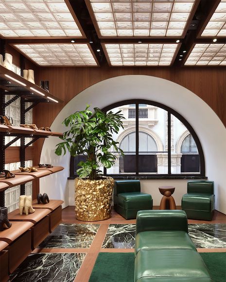 Green shades, marbled textures, leather furniture and gold accents adorn the store. Image credit: Bottega Veneta/François Halard