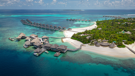 Over-water huts are becoming social media influencer staples in the luxury digital space. Image credit: Six Senses