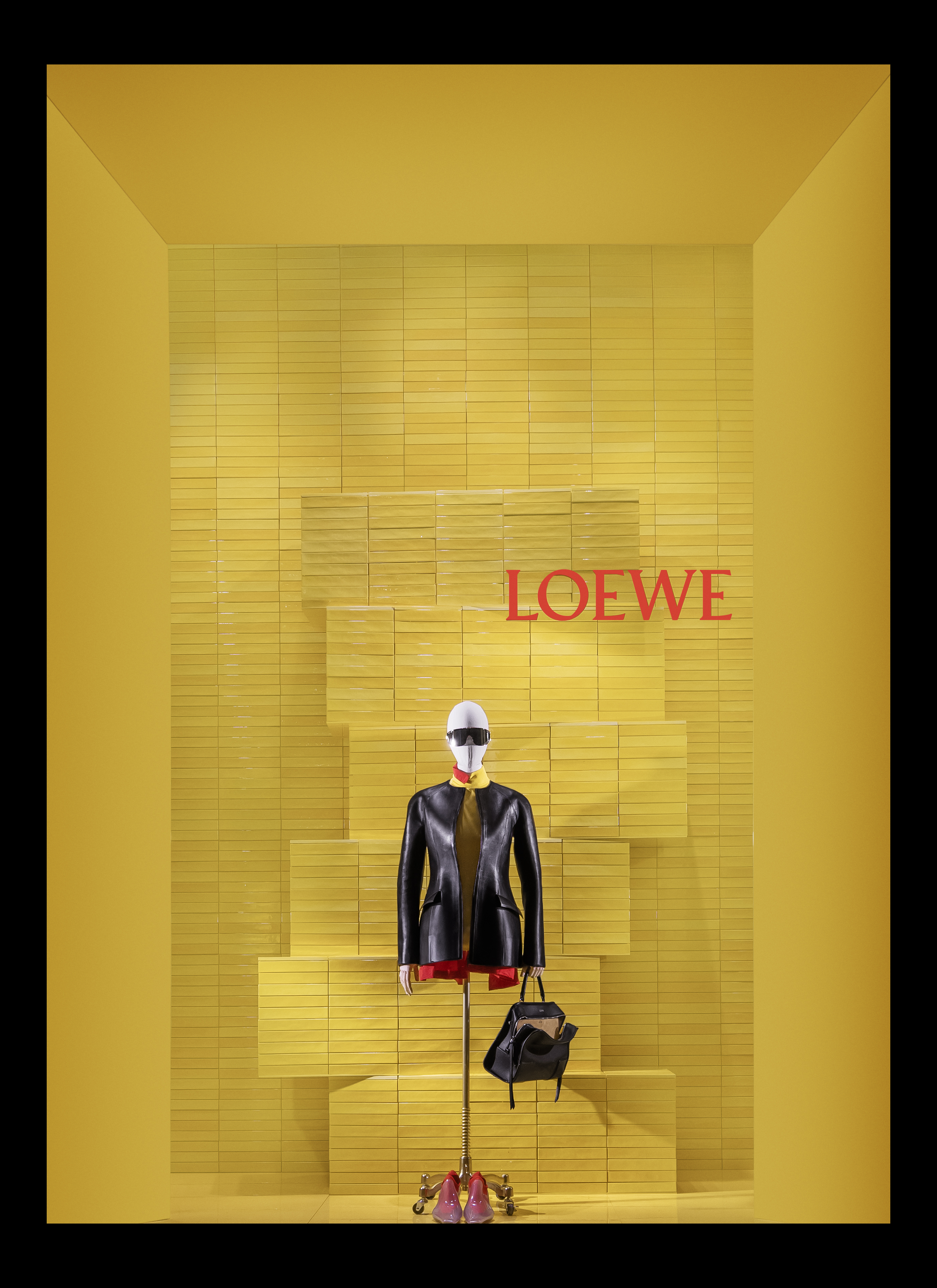 The retailer’s Fifth Avenue windows stage women’s ready-to-wear looks, leather goods and accessories from the Loewe collection. Image courtesy of Bergdorf Goodman/Luis Guillen